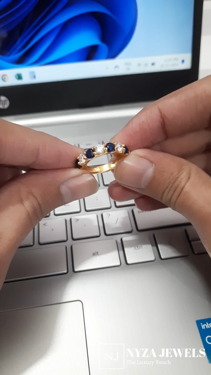 Blue sapphire five stone ring with moissanite diamond