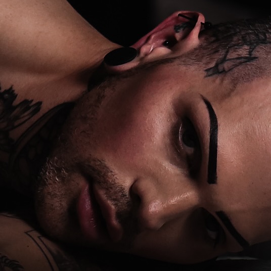 When his eyes meet yours, time slows, and the world around you fades away, leaving only the heat of his stare, a silent confession of longing and desire.