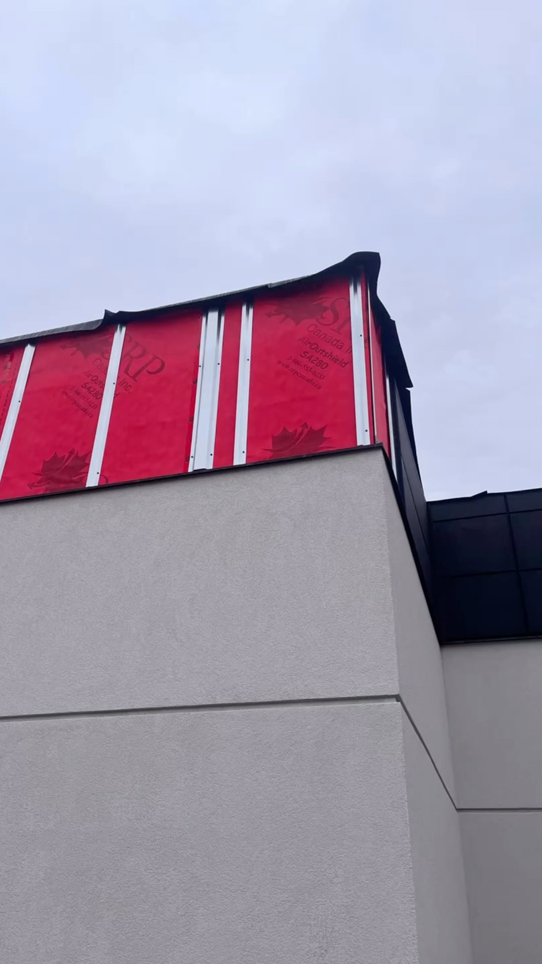 Water Resistive Barriers @srpcanada_inc featuring AirOut shield SA280 over masonary block, no primer needed, even at this time of the year. Contact us for pricing and technical details. Cladding @macmetalarchitectural Polymac panels in Titanium Black.