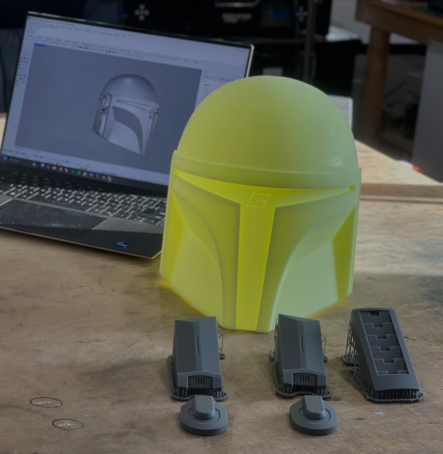 G.I. V2 Helmet master and greeblies printed and ready for cleanup! I released the original G.I. Helmet in 2019 and it quickly became one of my most popular helmets. V2 will keep the simplicity of the original design, but introduce a few slight changes: narrower ear base; new ear caps and rear key slot; tiny upward curve to the T visor brow, making the eye slit a few millimeters narrower at the nasal bridge than V1. V2 will also be much sharper and cleaner than the original. I’ll have more detailed comparison shots of V2 and V1 once the new master is ready for molding. Stay tuned! #mynocksden #mandalorian #mando #propmaking
