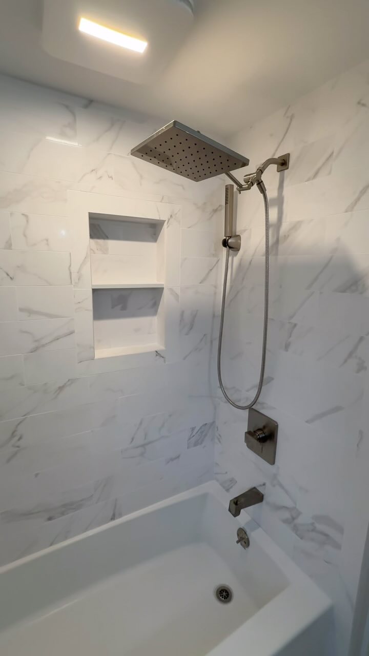 Complete bathroom renovation, using floor and decor tile and delta fixtures. All done by @aceremodelingnj