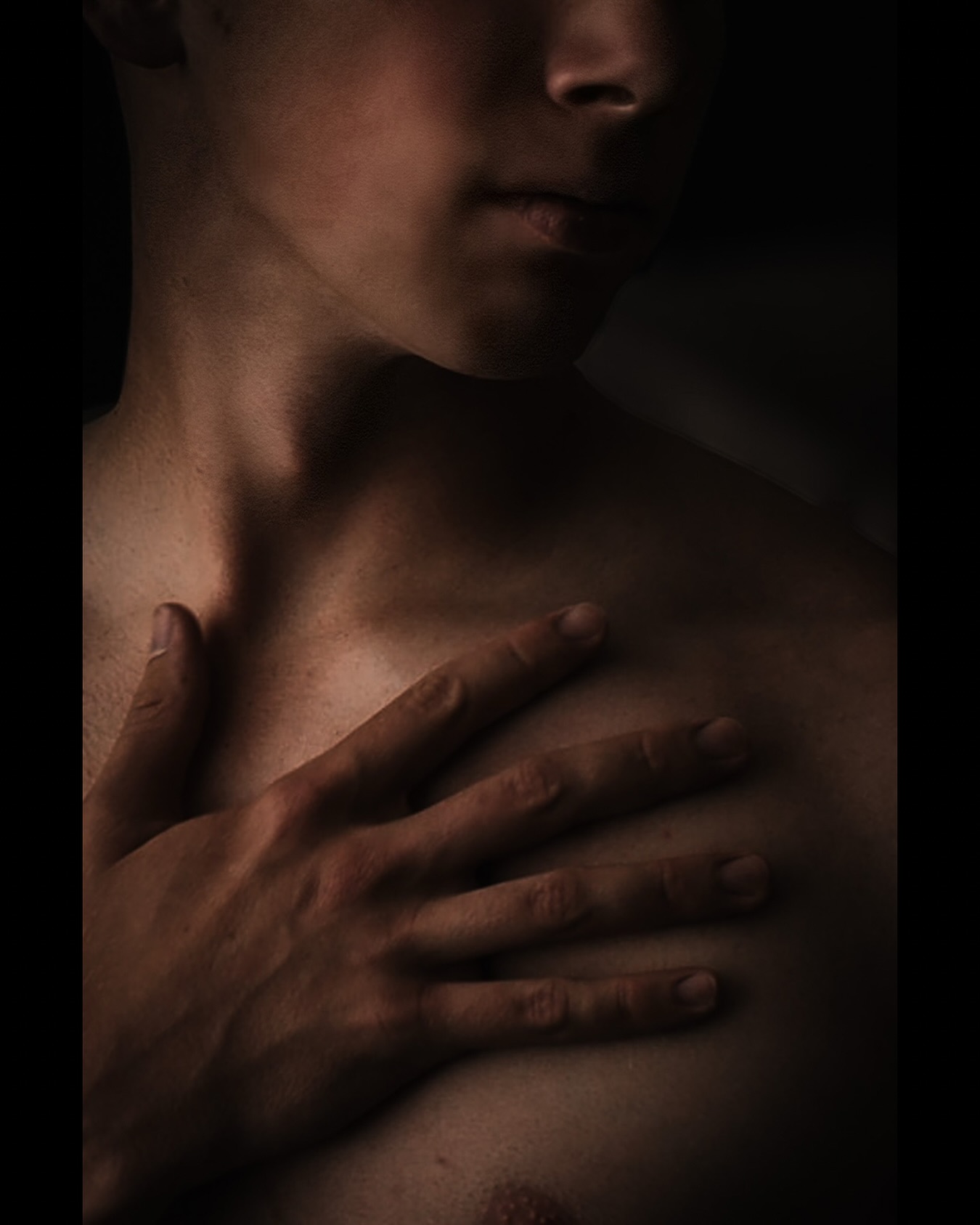 In the half-light, he stands as a mesmerizing enigma, shadows caressing his form like whispered secrets, drawing you closer to unravel the allure concealed beneath layers of yearning and mystery.