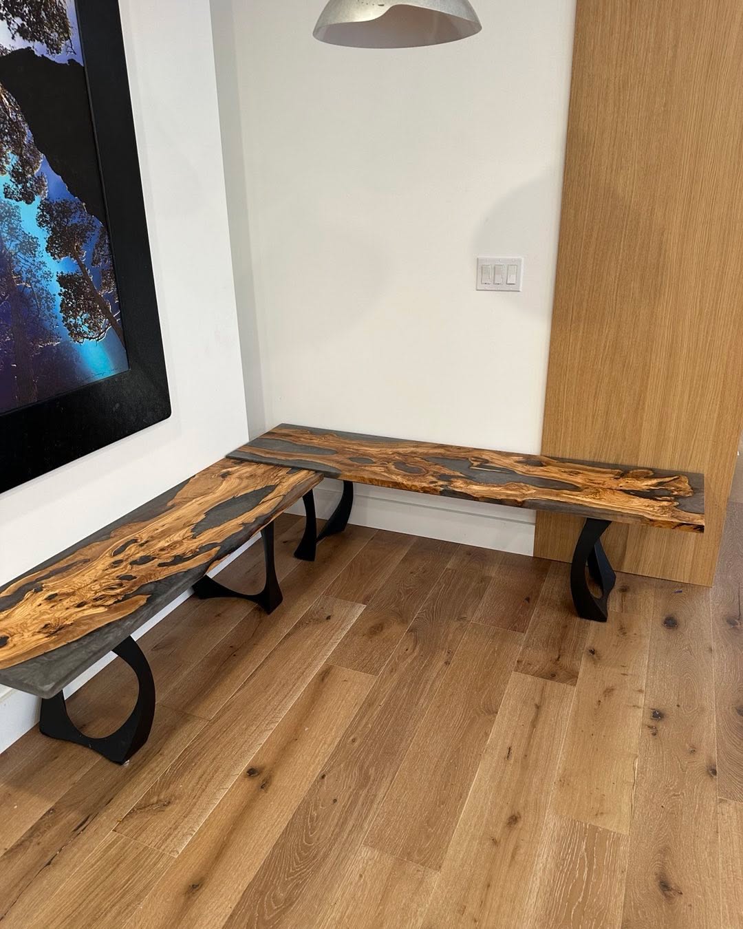 Live edge olive and resin benches that match the dining room table…..