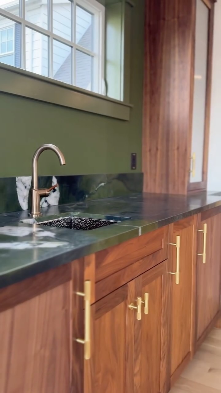 Thrilled to unveil this custom wet bar featuring the stunning Avocatus stone! The moment I first saw this stone, I knew I had to find it a home one day—it was simply too unique and beautiful to pass by. When this project came along, I knew it was the perfect match. Its lush green hues pair seamlessly with the rich, bespoke walnut cabinetry, creating a harmonious blend of natural warmth and elegance. Huge thanks to my incredibly talented cabinet maker and finisher for bringing this vision to life with such precision and care—it wouldn’t have been possible without their craftsmanship!
Designing this space around such a standout piece has been an absolute joy! 🌿✨
Custom cabinets: @jm_woodman
Conversion varnish: @nathan_olean_painting
#DesignInspiration #LuxuryInteriors #AvocatusStone #walnut #walnutcabinets #conversionvarnish #wetbar #design #customcabinetry #woodfinish #finewoodworking #custom