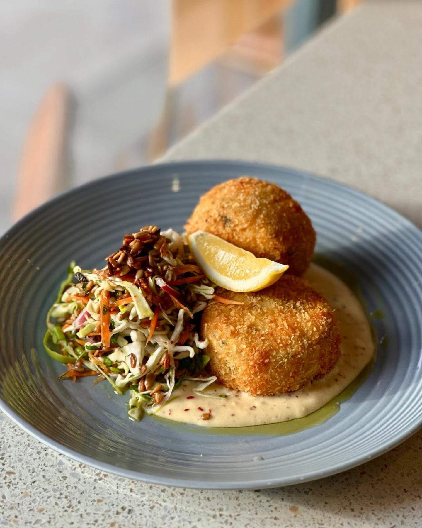 Prawn & smoked haddock fish cakes, mustard sauce, vinegar slaw
