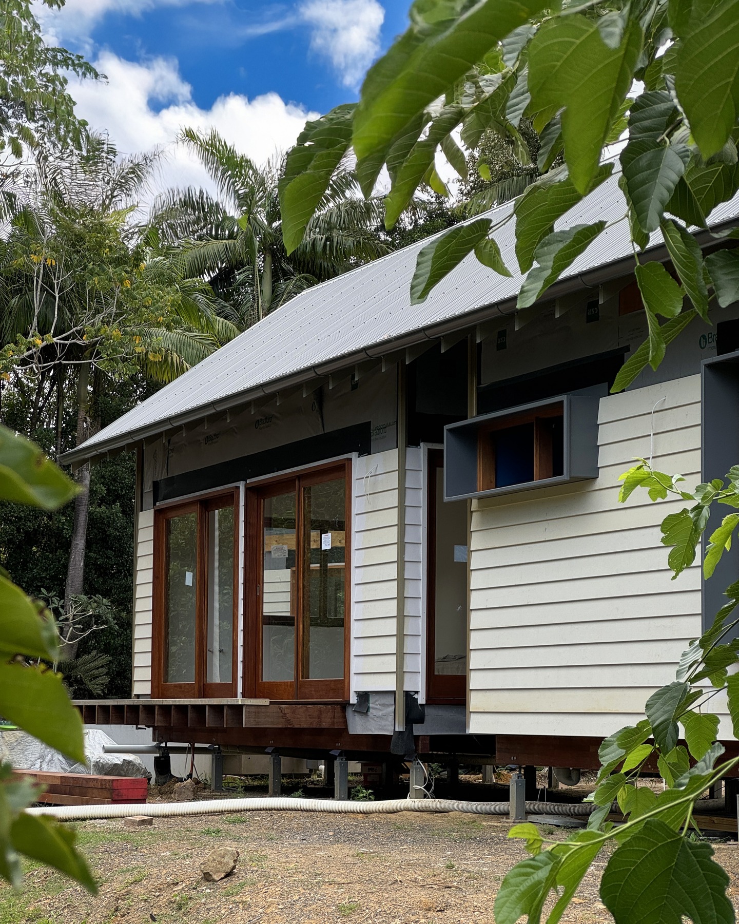 Our cabin build is well underway in rural Northern NSW.
We can't wait to see @leon_builds and his team of carpenters link the new additions and the refurbished existing cabin together with the decks and patio roofs.
Once a banana packing shed, then small dwelling, this soon to be holiday home allows our clients' love of their property to be enjoyed for another 30 years and into the future.
The cladding work is 3/4 complete and is to be finished off with FC sheet and battens to the upper portion as a nod to the residential architypes of the region.
The interiors are lined and ready for their bespoke fit-out which has been meticulously designed by @wrightson_stewart in collaboration with our building design response.
Being in a BAL-19 bushfire zone, all the exposed timbers are hardwood. We've specified recycled tallowwood decking and recycled Ironbark for the balustrades which are available from one of our favourite suppliers, @aahardwoods, in Kempsey NSW.
The landscaping and @plungie.australia pool will really bring this one home at the end, so stay tuned.