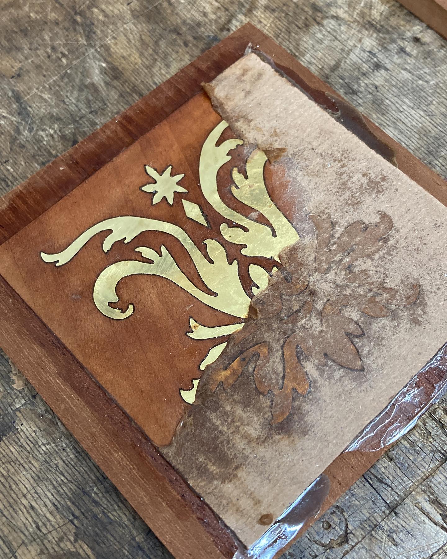 Uncovering a little marquetry piece done in brass and pear wood. This is a very simple boulle marquetry practice where the pieces are layered in a pack and cut at the same time. I love the way the brass shines next to the more textured pear.