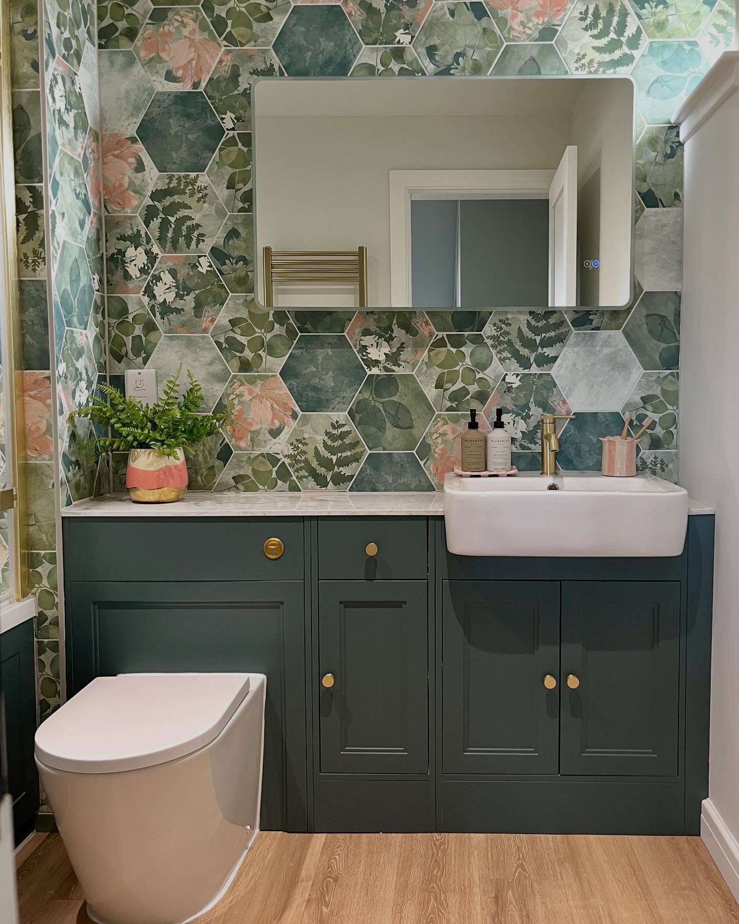 BATHROOM OF DREAMS ALERT!!
When my clients engaged me to help them redesign their home, they were keen to be challenged to step outside their comfort zone. Bold pattern and colour can often be intimidating but they took a big leap of faith which has really paid off in their en-suite bathroom.
The beautiful tiles from @capietra are absolutely the star of the show, complemented by the warm brass accents and wooden floor.
Entering the room feels like stepping into nature - great for promoting a sense of calm and wellbeing.
