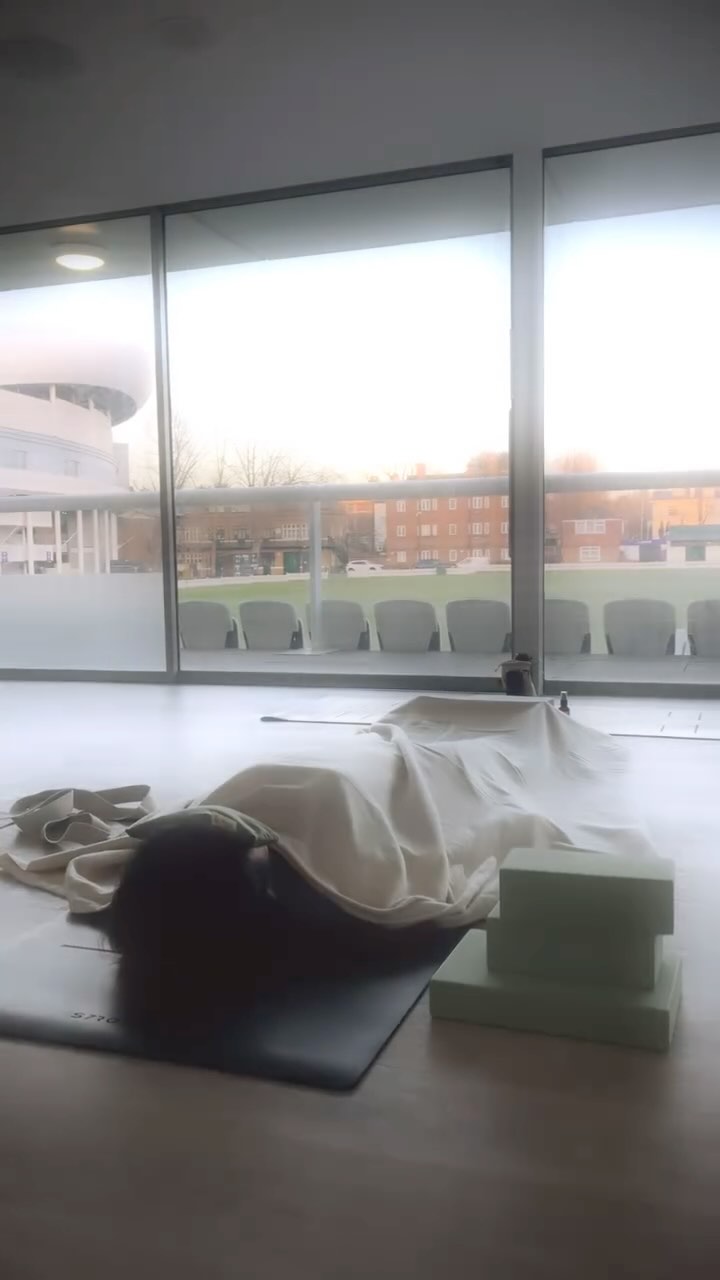 ✨ Savasana: The Art of Deep Rest ✨
In a world that glorifies movement, productivity, and doing more, Savasana is a quiet rebellion. It is the practice of not doing—of allowing, surrendering, and simply being.
At the end of every yoga practice, we come to this space of stillness. The body, after flowing and stretching, softens into the earth. The breath, once active and intentional, settles into its natural rhythm. The mind, so accustomed to effort and striving, is invited to rest.
This moment—this pause—is just as essential as the poses that came before it.
Savasana is where integration happens. The nervous system shifts into a state of deep restoration. The muscles release residual tension. The mind learns that it is safe to let go. And in this letting go, something profound occurs: we remember that we are not just our thoughts, our achievements, or the roles we play. We are presence itself.
Here, at Lord’s Cricket Ground, in collaboration with Fit With Me Filipa, my students rest in this sacred stillness. Each one, in their own quiet way, embodying the beauty of Savasana—not just as a posture, but as a practice for life.
Because true rest is not a luxury. It is a necessity. And in learning to rest deeply, we learn to live fully.
✨ May we all remember to slow down, to soften, and to receive the gift of rest. ✨
🌿 Have you ever truly allowed yourself to rest? Share your experience in the comments.
#Savasana #YogaRest #DeepRest #YogaForTheSoul #StillnessSpeaks #SacredPause #HolisticHealingArts #YogaInLondon #MindfulMovement #LordsCricketGround #FitWithMe #YogaWithIntention #RestIsProductive #NervousSystemReset #YogaForEveryBody