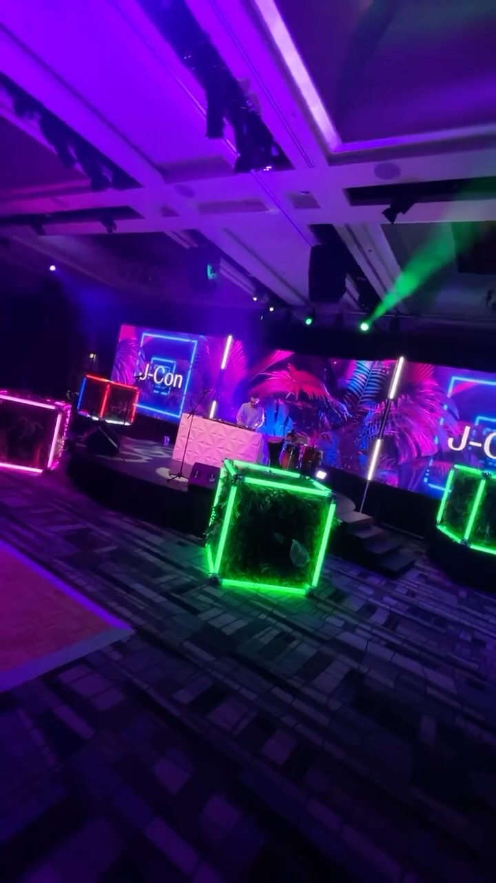 At the end of 2024, JnJ enlisted the help of AOV to bring to their J-Con conference to life. This saw the Sheraton Mirage turn into a neon themed jungle for the gala dinner party. The room was lit with bright colours, from the neon centrepieces to the LED x Greenery cubes and brightly coloured stage set. Tying it together, waterfalls of greenery were suspended from the roof, while our green wall was used outside as a photo opportunity with a red “JnJ” neon. What a night to remember!
Let us help make your dreams a reality for your next event!