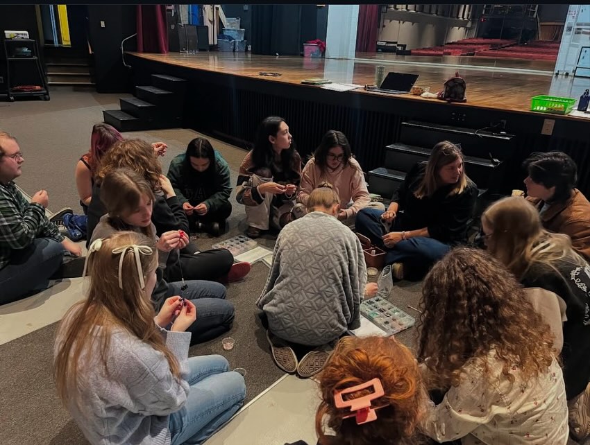 Thank you @ncuhsdancedrama for including me in your process. “A very special thank you to @suzjonesey for coming into the auditorium today to work with Drama Company students! We had a lovely time making @norah.beads and discussing the intention behind our play that these kids will be performing at the VT One Act Festival. Susan has played and continues to play a vital role in supporting and providing resources for our production. Talking about suicide and mental health can be really tough but she was here to offer a safe space to have these powerful and meaningful conversations where students truly feel heard and understood. Our community is so lucky to have you 💜🩵 “#yourmentalhealthmatters