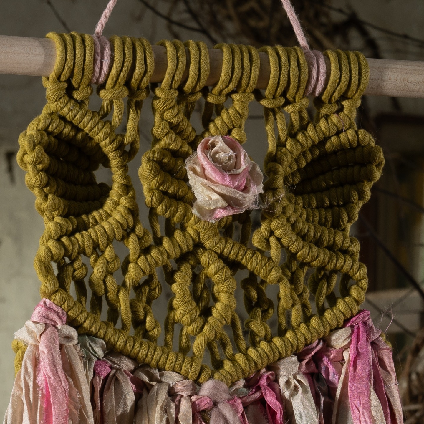'Olive Rose' is a handmade piece of wall art using the traditional knotting technique of macrame with soft twisted cotton cords, merino wool and silk Indian sari ribbons in a harmonizing colour palette of olive, pinks, lavender and pale peach. The piece is suspended from a natural wood dowel and features a hand-sculpted silk rose.
karenmorganart.com
info@karenmorganart.com
#art #texturalart #fiberart #macrame #interiordecor