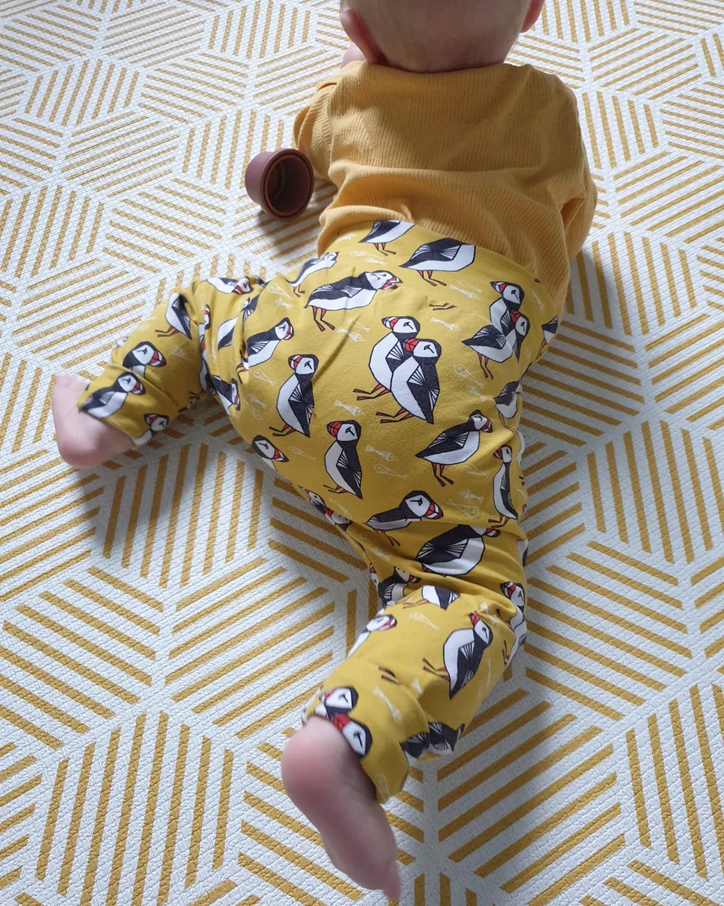 Puffins are one of our best selling prints and it's not hard to see why. I love the combination of geometric puffins on a sunny yellow background!
I've sewn up all of my puffin fabric for now (I'll restock more when I'm back from maternity leave) so it's not available in made to order at the moment. But the good news is that I have LOADS of puffin trousers and bibs ready to ship in almost every size from 0-8 years. They won't last long, so check out the website if you want to grab some puffins before I finish up for maternity leave.
#puffins #colourfulkids #madeforplay #organickidsclothing #organicbabyclothes #uniquekidsclothes #handmadeforbaby #UKMakers #ukmums #scottishsmallbusiness #scottishmums #madeinedinburgh #indiekidswear