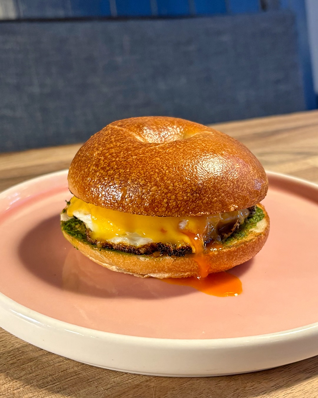 The perfect grab n’ go breakfast - an egg & cheese bagel. Cacklebean fried egg, american cheese, house hot sauce on @banookbagels 🙂↕️🥯