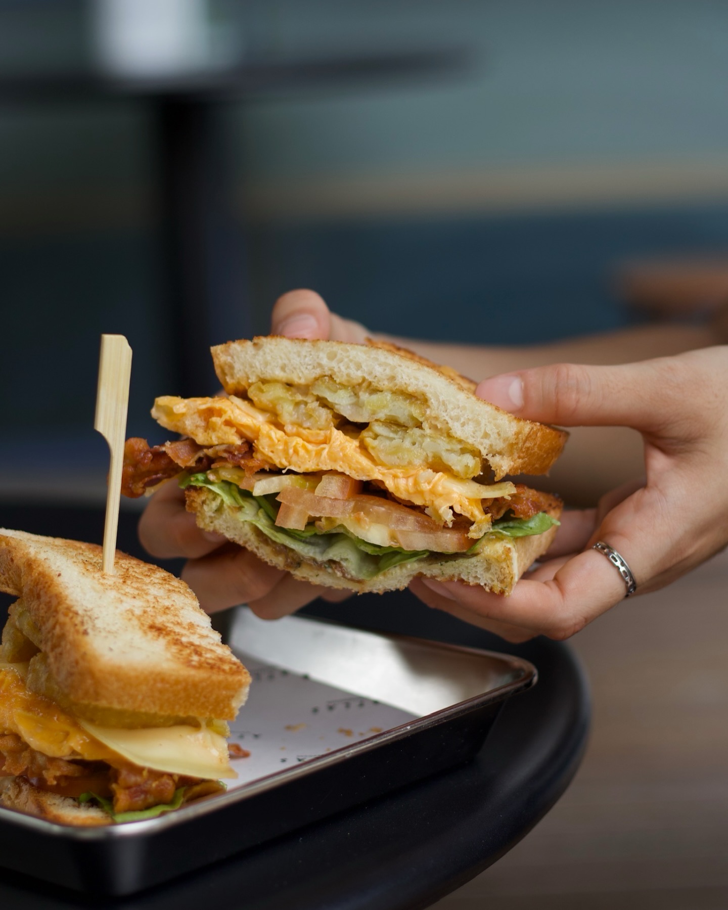 Here’s a breakfast platter you can hold!
Monday's Breakfast Sandwich — Shokupan, streaky bacon, scrambled eggs, hashbrown, sliced cheese, herb garlic aioli, fresh romaine & tomatoes.