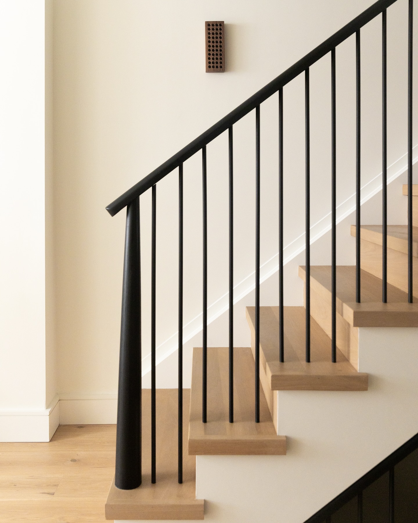 One of my favorite parts of this house is the original chimney we left exposed from the basement to the second floor. A subtle reminder of the home’s history—and a way to make transitions a design statement. Swipe to check it out 👉🏼