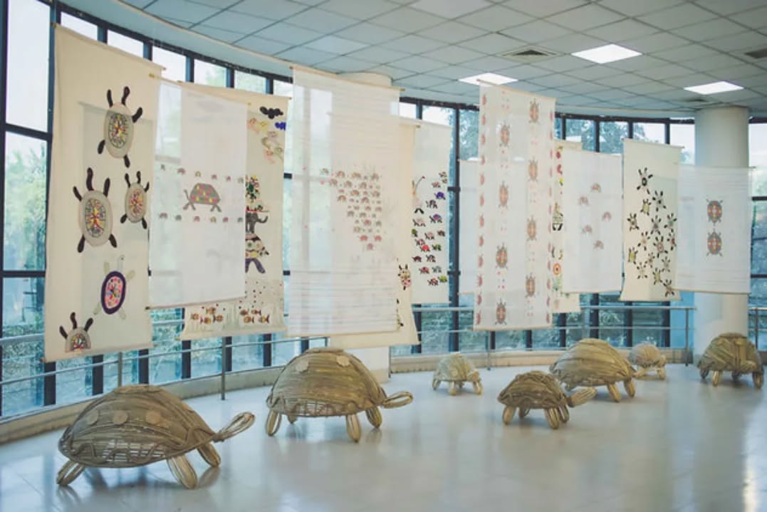 #ThrowbackThursday
Today we look back at ধীরে বন্ধু ধীরে (Slow friend, be slow), 2022-2023 by Shawon Akand from DAS 2023.
Turtles are icons for slowness, and slowness is necessary to keep certain cultural practices alive that fall outside of the speed necessary for mechanical reproduction. Shawon Akand worked with traditional jamdani weavers to transform turtle motifs in his paintings into a woven installation. ধীরে বন্ধু ধীরে (Slow friend, be slow) questions where in the fast paced world the need for slow process work falls, and how slowness can be adapted in this timeline of urgency. When a slow-pace culture merges with a fast paced life, will any good come out of it?
Akand’s body of work questions cultural norms with a critical perspective on social and political structures through painting, printmaking, installation, photography and video. He is passionate about empowering and amplifying the reach of Bangladeshi craftspeople in his creative work which extends from art making to curating to entrepreneurship. He founded the organization Jothashilpa which has been a melting pot where various categories of arts (such as fine art, folk art, native art, crafts etc.) are brought together to create a new art language rooted in cultural history.
Photographs of ধীরে বন্ধু ধীরে (Slow friend, be slow), 2022-2023 by Shawon Akand from DAS 2023.
Commissioned by Samdani Art Foundation
Courtesy of the artist
@dhakaartsummit
@samdaniartfoundation
@nadiasamdani
@rajeebsamdani
@dhakadiana
@rux_q
@swilin_haque
@sazzad1985
@iftekharnoor
#dhakaartsummit #samdaniartfoundation #dhaka #sylhet #art #artwork #DAS #exhibitions #contemporaryart #artistresidency #SAF #shawonakand