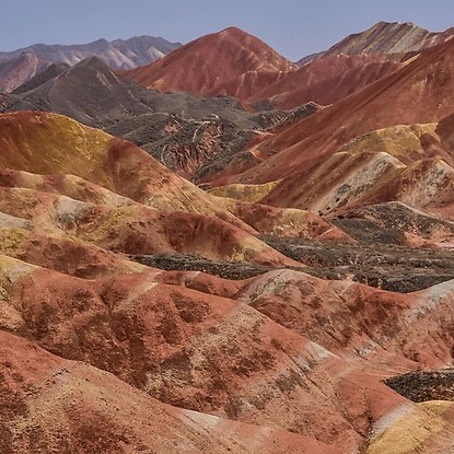 Along the Silk Road by the Rainbow Mountains.
