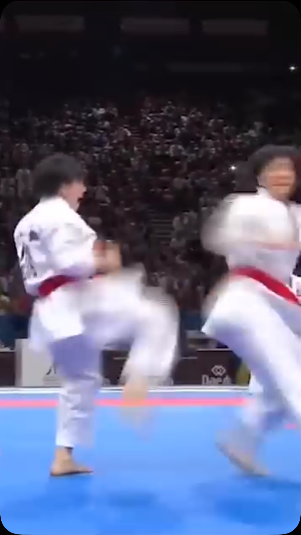 Female Japanese kata team performing bunksi - very impressive choreography of their kata.
