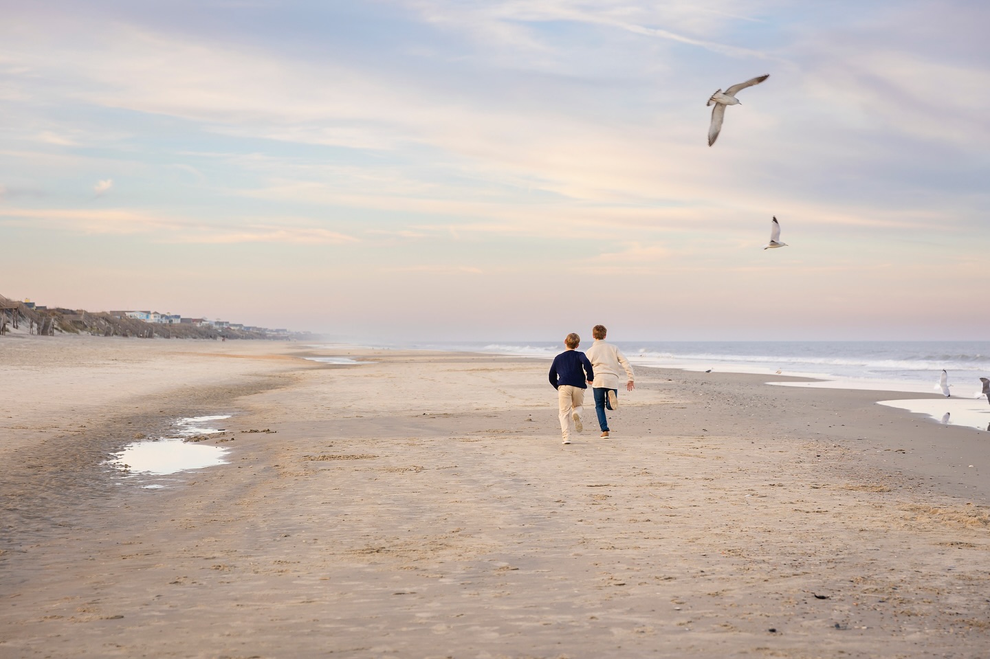 We met these fabulous repeat customers on the beach in Corolla for their family photos. This off season family photo session had an extra element of cozy with neutral sweaters and the warmth of the sun brushing the dune line. Don’t count out the off season for beach photos! Sharing more on the blog today! #outerbanks #obx #obxfamilyphotographer #corollanc #obxbeachportraits