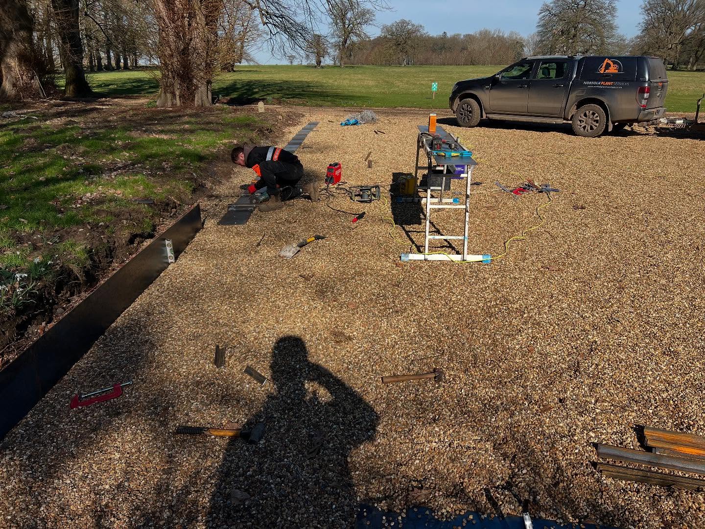 We have been installing some steel edging today. Fabricated on site. Finished off with yew hedging. This really sets of the new car park.