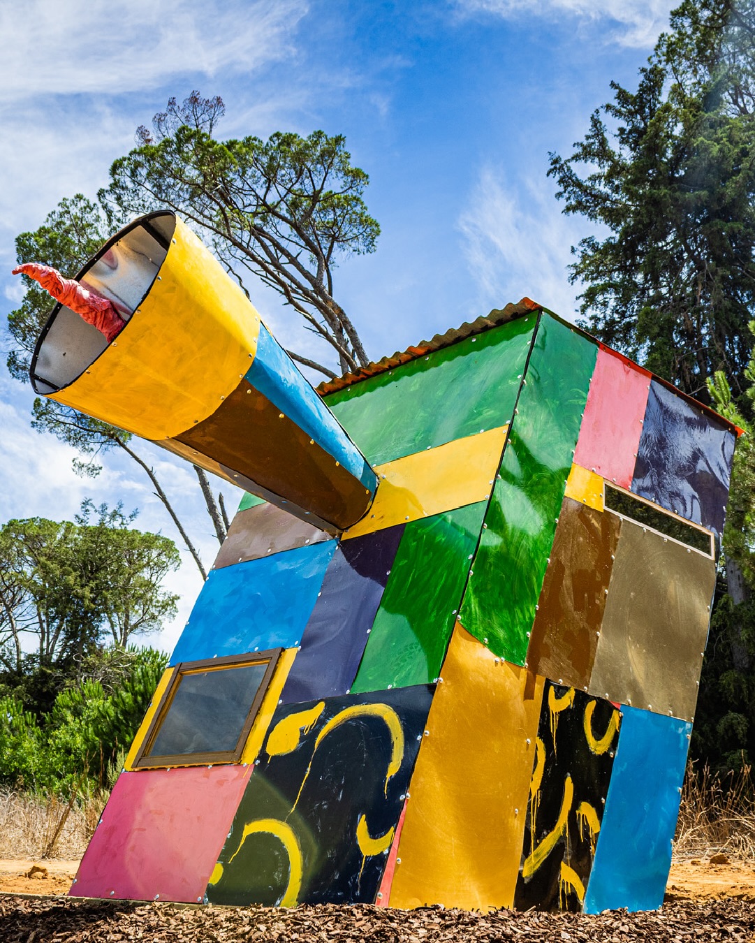 Title: Iphupho (A dream)
Artist: Simphiwe Ndzube @ndzube_studio
Exhibition: Stellenbosch Triennale 2025 In the Current
Drawing from his most recent figurative paintings with open mouths, we are reminded how ideas, fears, and dreams themselves are spoken or sung into existence. The iconography of the corrugated walls and roof elicits a recognisable structure in (Black) South African living. A structure which is necessitated by the desire to build refuge. Here the structure is tethered to the imaginary worlds depicted in the paintings, and the artist proposes alternate readings, suggesting that a shack can be ‘a space for imagination to happen.’
View Ndzube’s installation at Oude Libertas until the 30th of April. For the full artist statement, visit www.stellenboschtriennale.com/artworks/iphupho-breathing-under-duress
©️Images by @jumpinthegun_creative and @stellenboschacademy
#ST25 #ST2025 #StellenboschTriennale #StellenboschTriennale2025 #SimphiweNdzube #ArtInstallation