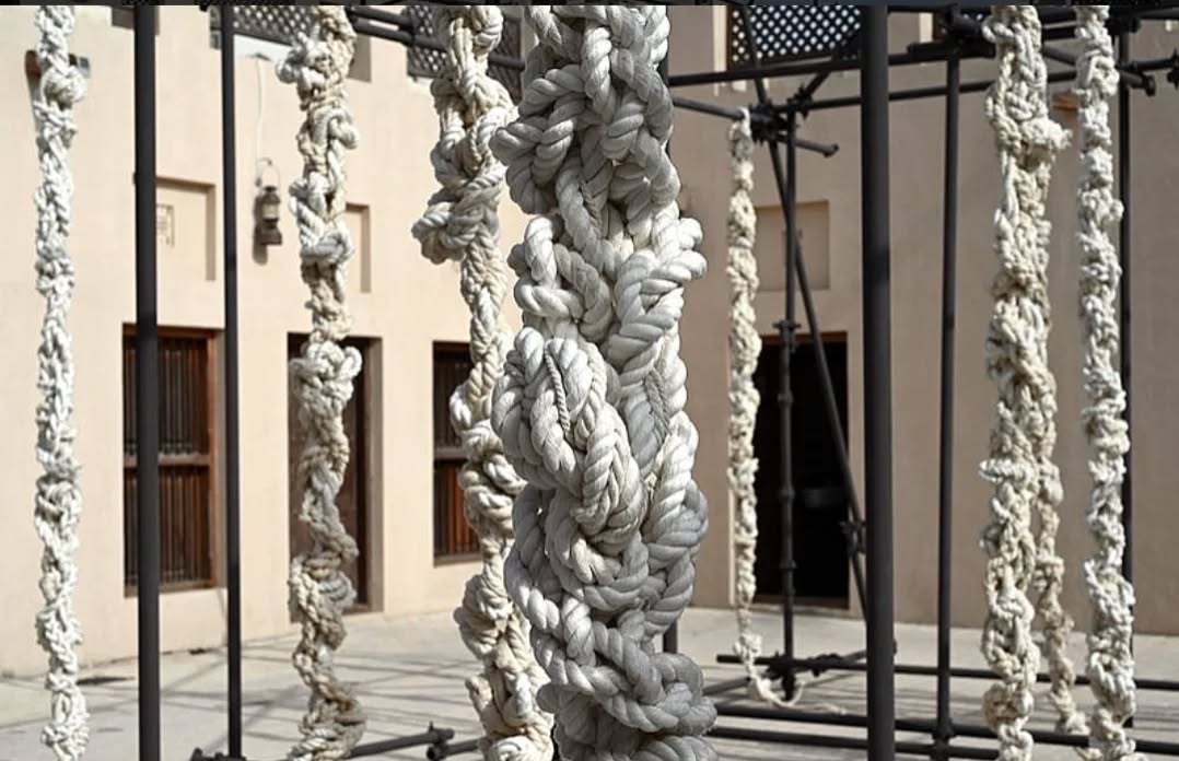 Congratulations to our long term DAS collaborator Reetu Sattar, on exhibiting her work ‘জট’(Knot), 2024, at Sharjah Biennial 16, ‘To Carry’, at The Calligraphy Square. Curated by Alia Swastika, Amal Khalaf, Megan Tamati-Quennell, Natasha Ginwala, and Zeynep Öz, the Biennial brings together diverse artistic interventions across multiple venues.
Guided by somatic intelligence, Reetu Sattar’s artistic practice reflects on hidden stories, colonial historiography, and unequal labor cycles in Bangladesh. The outdoor installation *জট* (*Knot*) (2024) highlights the multiple disruptions in South Asian history, beginning with the 1765 Treaty of Allahabad—a pivotal moment of colonial entrenchment. This treaty transferred control of significant eastern territories from the Mughal Empire to the British Crown, initiating a cycle of erasure and subjugation that distorted the cosmopolitan histories of architecture, literature, and music across the Indian Ocean region.
The life-sized ropes and recursive knots of ‘জট’ (Knot) serve as material witnesses, binding hand-spun and industrial textiles to cycles of colonial extraction and corporeal memory. Sattar seeks to rediscover the worlds that vanished during colonial times, making their absence tangible. Constructed as scaffolding with an interrupted canopy, this open-air "theater of memory" invites visitors to engage with the historical burdens of textile production and circulation throughout the Indian Ocean region.
Commissioned by Sharjah Art Foundation.
Photograph by Haupt & Binder, Universes in Universe.
@dhakaartsummit
@samdaniartfoundation
@nadiasamdani
@rajeebsamdani
@dhakadiana
@rux_q
@reetusattar
@sharjahart
@alia.swastika
@maoriartcurator
@amalandaplan
@natasha_ginwala
@zeynepozz
@swilin_haque
@sazzad1985
@iftekharnoor
#dhakaartsummit #samdaniartfoundation #dhaka #sylhet #art #artwork #DAS #exhibitions #contemporaryart #srihatta #sculpture #SAF #sharjahbiennial #reetusattar