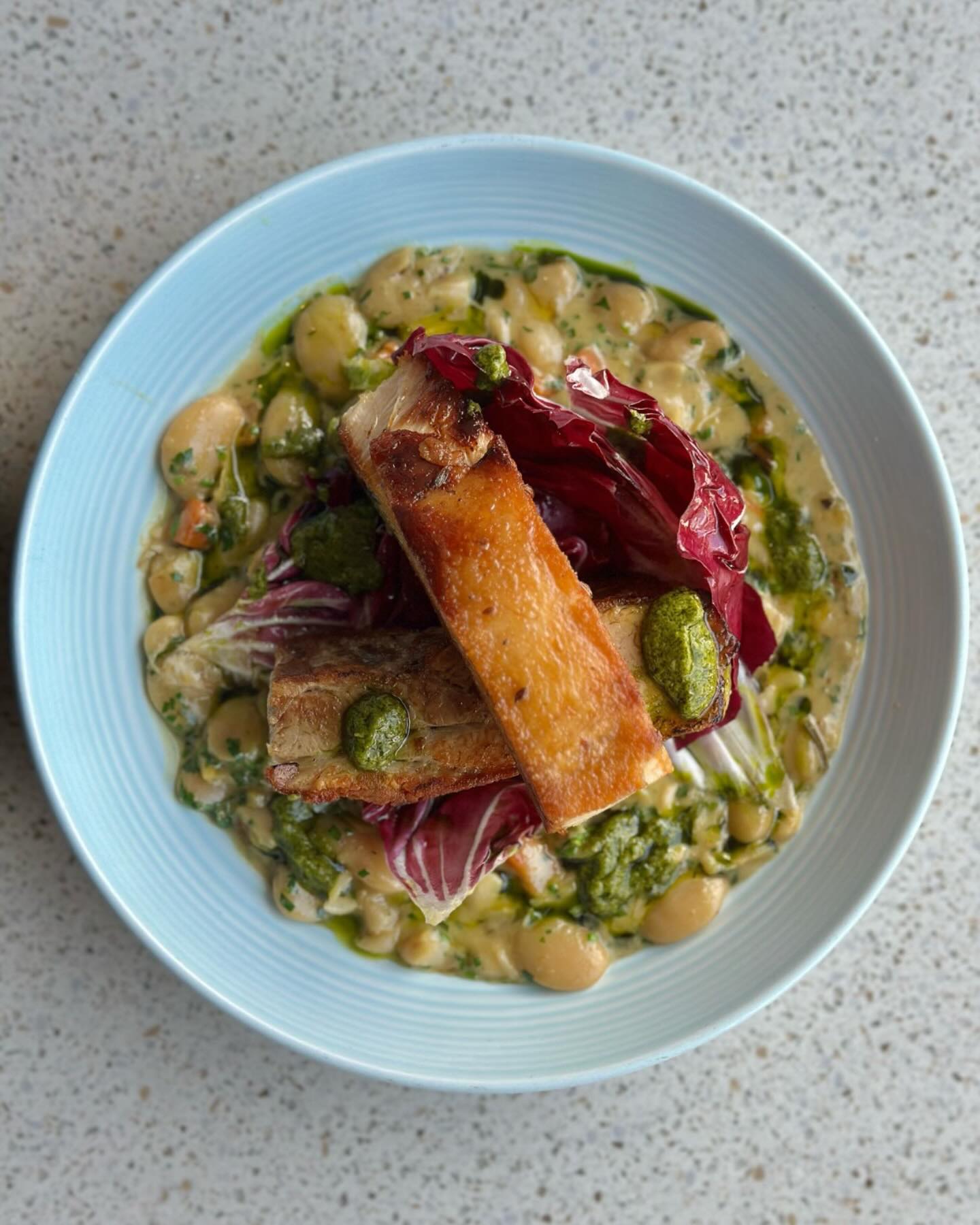 Lunch classic. £20 prix fixe with a glass of wine. Pork belly, creamed beans, radicchio, salsa verde.