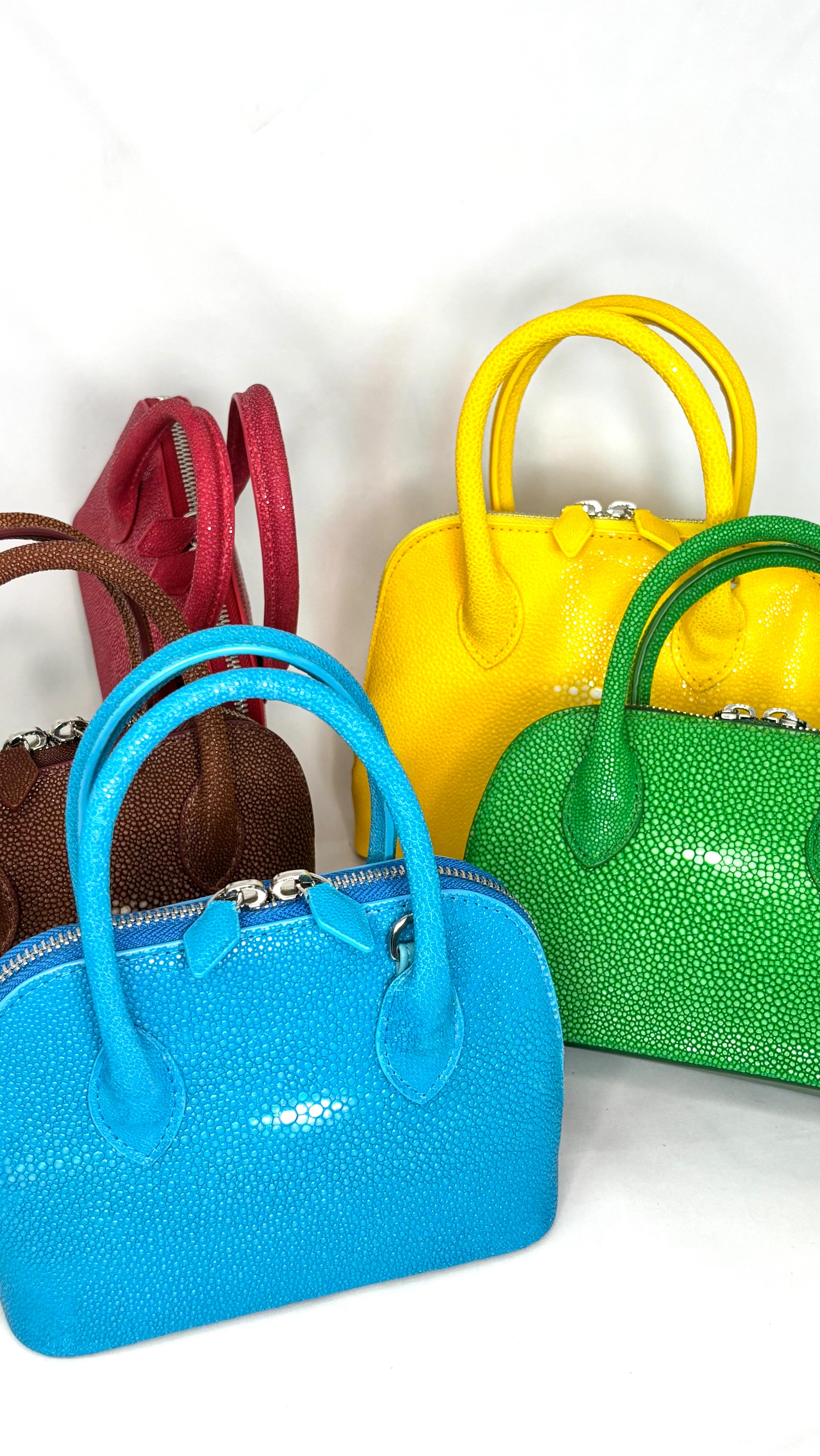 A pop of color, a touch of exotic luxury ✨—introducing our Mini & Small BB Bags. Crafted from the finest stingray leather, their radiant hues and natural brilliance redefine everyday elegance.
From the deep charm of ruby red ❤️ to the electrifying turquoise blue 💙, the sunny yellow 💛, or the lush emerald green 💚—each piece is a statement of artistry and sophistication. Compact yet refined, these treasures are perfect for carrying your essentials with effortless grace.
Which shade speaks to you? 🌈✨
#LuxuryEssentials #GaluchatBag #StingrayLeather #ExoticElegance #Seamemory #ExclusiveCraftsmanship #LuxuryGoods #LuxuryShopping #SaintBarth #SaintBarthShopping #TimelessLuxury #HandmadeLuxury #BeachChic #IslandStyle #EffortlessElegance