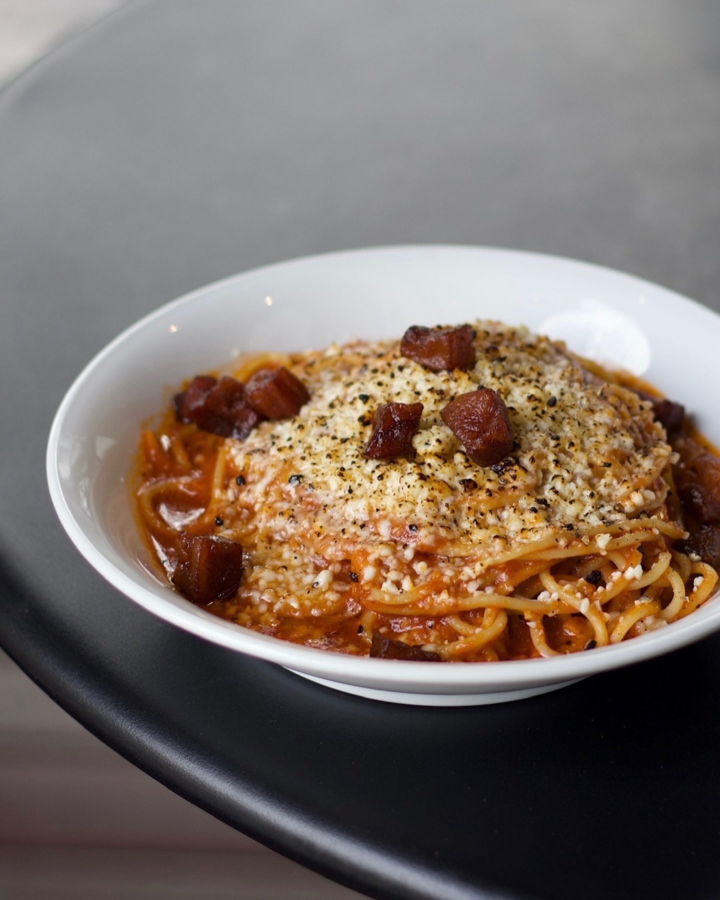 Spaghetti tossed with a fragrant tomato sauce made with pecorino and guanciale. So simple but so good.