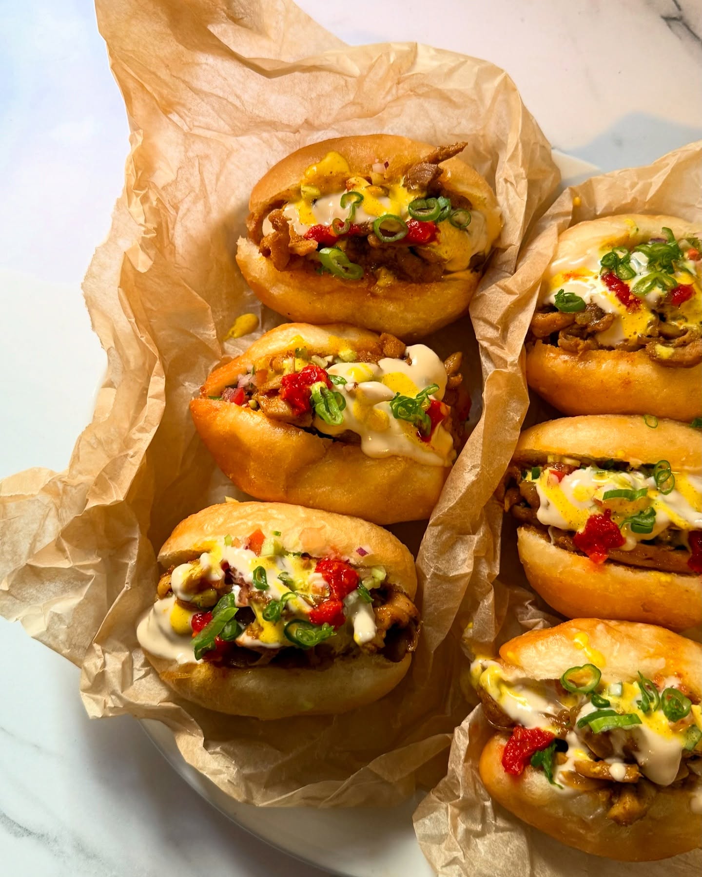 Mini Fricassé (Tunisian Fried Bread) – A Bite of Your Dreams
The original comes with canned tuna, but at Marva, we gave it an Israeli twist—filling it with chicken shawarma, Israeli salad, amba aioli, harissa, and tahini. It’s an explosion of flavors in one perfect bite!
🔥 DM to order a full tray! 🔥
🌿 #YallaMarVa
#Foodie #TrendingEats #IsraeliFood #TunisianBites #StreetFoodLovers #ShawarmaVibes #Fricassé #FoodExplosion #BiteMe #FlavorOverload #MiddleEasternEats