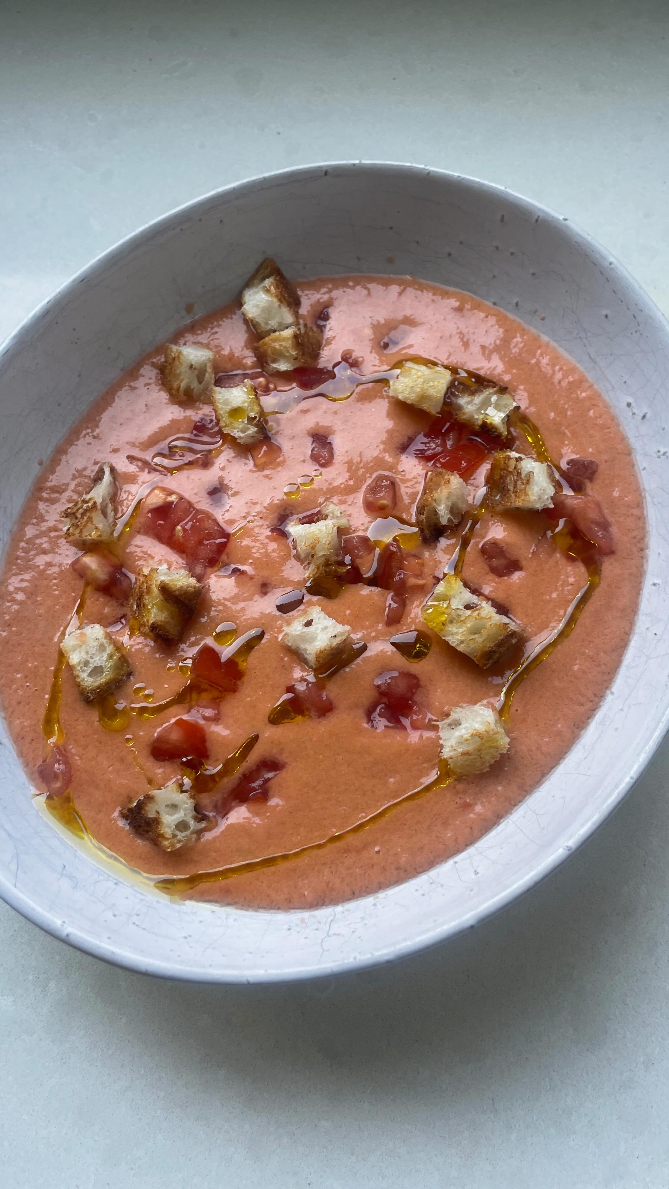 Flavours of Spain 🇪🇸
Watch how quickly my partner and I whip up this simple, delicious gazpacho! 😋
Gazpacho is a cold soup from Spain, and I fell in love with this dish during my travels there.
It’s perfect for a hot summer’s day 👌🏼 and although summer is officially over here in Sydney, the temperature this weekend says otherwise! 🥵 ☀️
Ripe sweet tomatoes are KEY to making this dish taste amazing 🍅
Gazpacho Recipe 👇🏻
Serves two
- 500g ripe tomatoes
- ½ cucumber
- ½ capsicum
- 2 garlic cloves
- Sherry vinegar to taste
- Olive oil
- Salt to taste
The amount of vinegar can vary, so don’t be shy. Taste and adjust to balance the flavours.
Method:
1. Coarsely chop the vegetables.
2. Blend, blend, blend!
3. Typically, it’s strained, but I like to keep the texture for all the goodness aka fibre, vitamins, and minerals.
4. Chill for minimum 2 hours or overnight.
When serving, top with extra tomato, cucumber, herbs some extra olive oil or my favourite—garlic croutons 😋
#FlavoursOfSpain #Gazpacho #FreshAndSimple #Healthy #Nutritionist #NutritionTips #Yum #Food