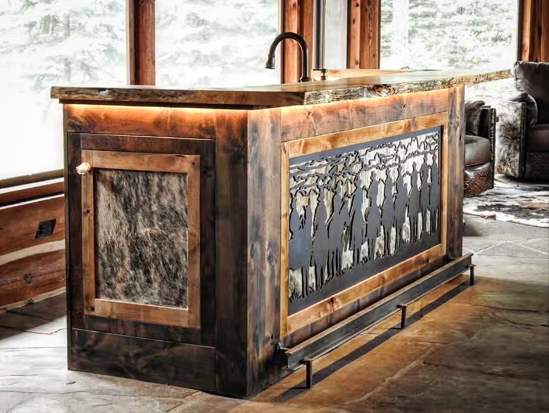 Custom design, fabrication & installation of this cowboy bar was the perfect way to finish this sun deck for our client. We had limited space but didn’t want to sacrifice any function, so we made sure every inch was accounted for and even incorporated hidden bottle and glass storage in the ends for the extra special stuff 😉 #cowboybar #custombar #westernbar #westerndesign #customcabinetry #custombuilding #bigforkmontana #strongholddesign #strongholdbuild #bigironmetalworks