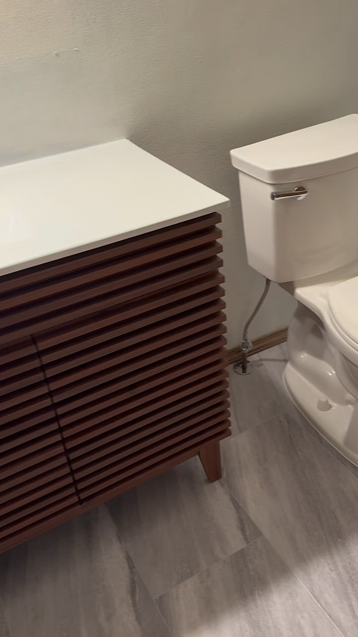Transformed this bathroom with stunning new flooring and a sleek vanity! Loving the fresh, modern vibe. 🛁✨ #BathroomRemodel