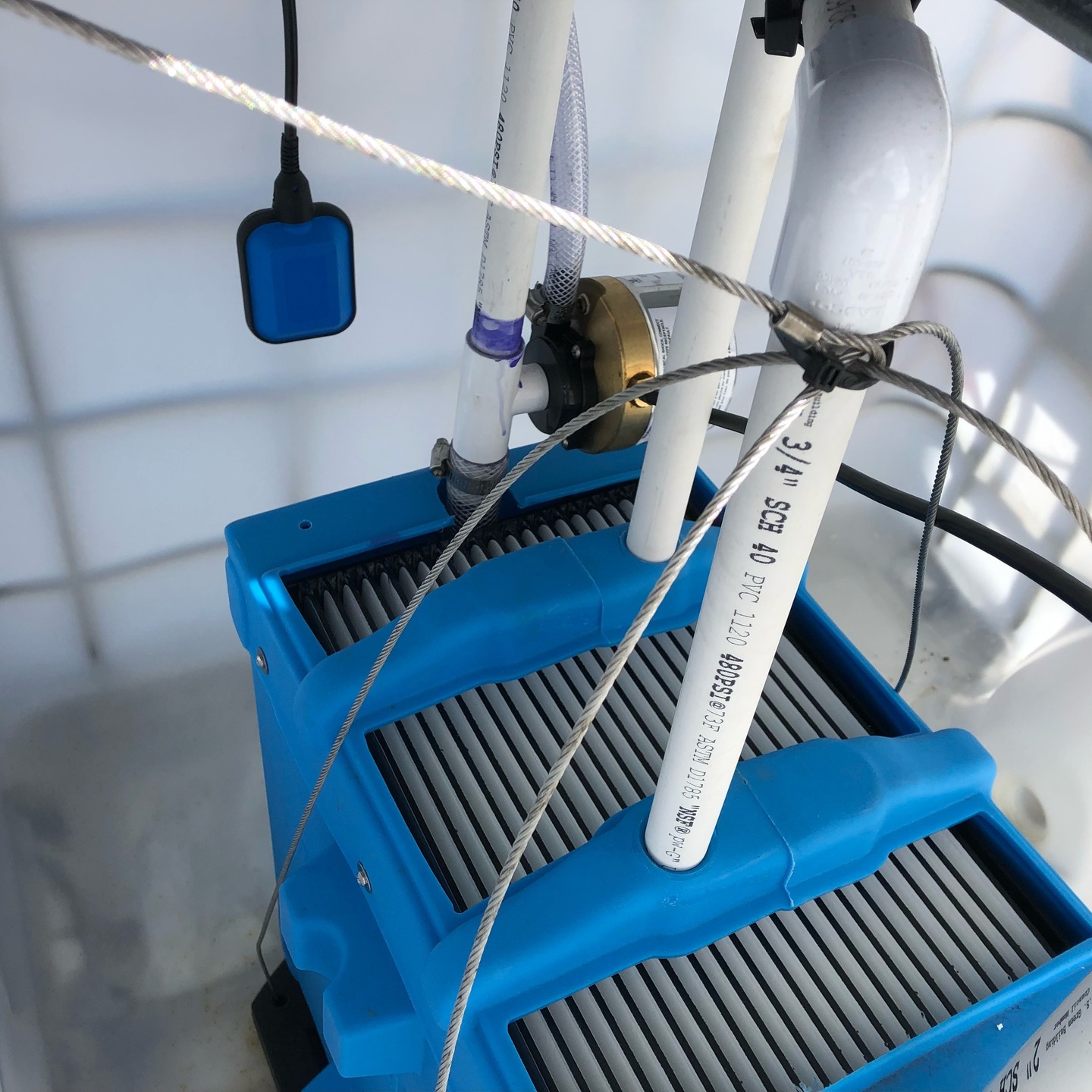 Shown is a BioMicrobics BioBarrier installation utilizing ultrafiltration to remove suspended solids and other organic pollution.
The beaker on the right shows the water before entering the BioBarrier, and the beaker on the left shows the treated water.