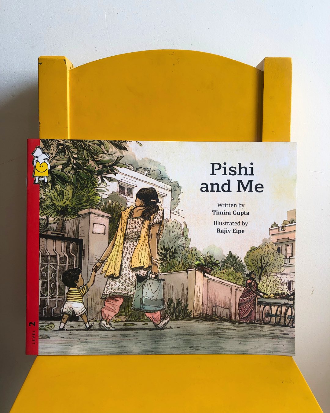 Pishi and Me
By Timira Gupta
Illustrated by Rajiv Eipe
Chutku loves his daily walks with his beloved aunt, Pishi. This charming book captures a child’s boundless curiosity and wonder, turning the seemingly mundane into moments of quiet magic. Every step of Chutku’s unhurried stroll is an adventure—whether it’s greeting the tiny critters on the road, watching birds flit through the trees, gathering fallen flowers, or collecting an ever-growing treasure trove of stones, both big and small.
Their walk leads them to the bustling neighborhood market, where every vendor has something to offer—both to Chutku’s inquisitive mind and his little box of wonders. And when they return home, each found treasure is tucked away safely, just as all cherished things should be. The heart of this story lies in its unhurried pace, celebrating the joy of slowing down, pausing, soaking in the world, and moving forward with wonder.
The illustrations by Rajiv Eipe are nothing short of brilliant, offering a child’s-eye perspective that draws the reader into Chutku’s world. The entire book is framed from his viewpoint—ground-level glimpses and upward tilts that mirror the way a young child sees the world. This thoughtful artistic choice adds depth to the storytelling, making the book not just a read but an experience. Rajiv Eipe continues to be one of our favorite illustrators, and this book only reaffirms why.
A story as simple as a walk, yet as profound as childhood itself—Pishi and Me is a delightful read that may just inspire you to slow down and savor a walk with your little one. For those looking to extend the experience, Nani’s Walk to the Park (for ages 3+) makes a perfect companion read.
Ideal for children aged 2+