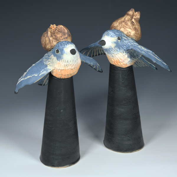 Blue Birds, 2024
Bird Baggage Series
ceramic, handmade figurines
Bird Baggage was inspired by a custom sculpture made for a couple who loves birds and how easy their later-in-life relationship with each other.
We all bring baggage to relationships. Birds often pair up and have wildly differnt relationship types.
Blue birds would keep things light with light pouches.
What type of bird would you and your partner be?
