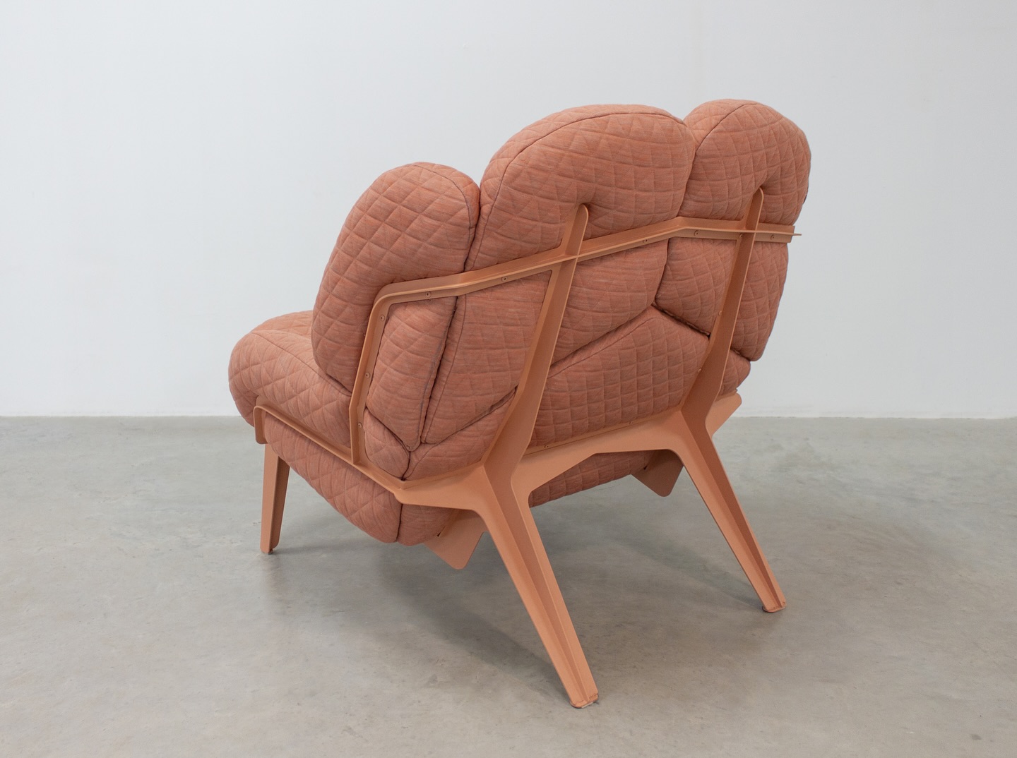 Monna Chair 2
During Dutch Design Week 2023, I showed the second version of an ongoing exploration of the Monna Chair. It’s a complex project I started almost 10 years ago, but it keeps calling me back.
I was inspired by a 25,000 year old figurine, the Venus of Lespugue, carved from mammoth tusk (!) and amongst the oldest known human art. The Lespugue is amongst many Venus figurines, all whose meaning is not known. I can’t help wonder about the people who made them. Were these voluptuous women fertility symbols? Earth mamas? What compelled a human to craft this with such care and detail?
The soft, round curves of the chair are reminiscent of these figurines of feminine nurturing and bounty, creating a safe and welcoming place to curl up into. The name Monna comes from an abbreviation of the old Italian, Ma Donna or my lady (also the etymology of the Mona Lisa and Madonna).