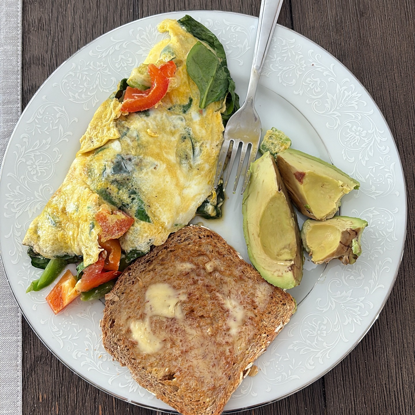 Breakfast/Lunch/Dinner Idea!
Eggs are so often thought to only be had at breakfast or lunch, but you can also cook up some eggs at dinner! If you literally have nothing planned for dinner but have some eggs and veggies on hand, throw together some omelets with veggies stirred in! Add a side of avocado and a slice of sprouted grain bread with some grass fed butter and you've got a solid nutritious meal!
What's in my omelet?
2 pastured raised eggs
3 slices of green and red bell peppers (diced)
Handful of spinach
3 slices of raw cow cheese (sliced from a block of cheese)
Salt and pepper
A splash of Elmhurst cashew milk to give the omelet a little more body. 😋