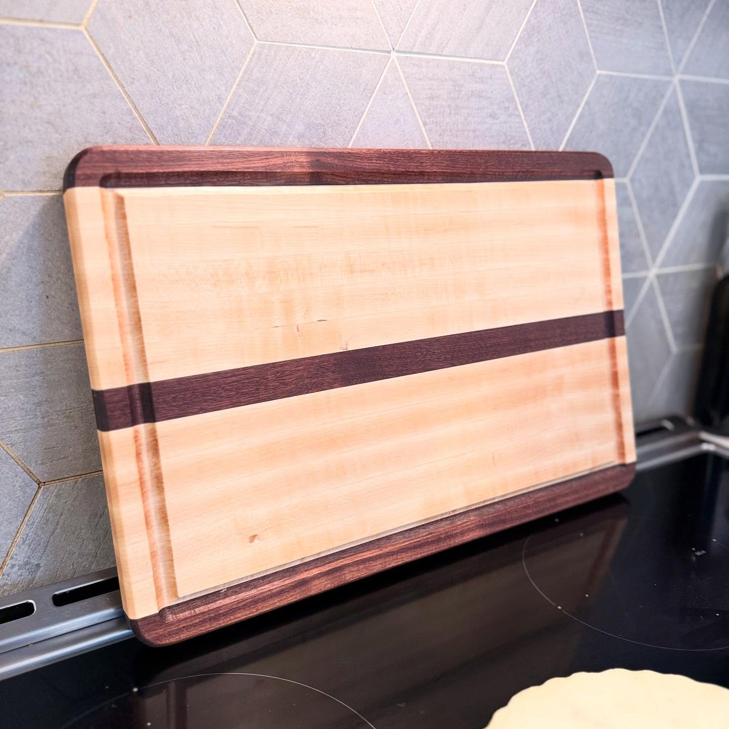New cutting board for @run_rudy to take home. This maple and walnut board will make a great everyday kitchen tool that also looks beautiful.
Reach out if you like a custom board for yourself or a loved one!
#homadewoods #woodworking #cuttingboard