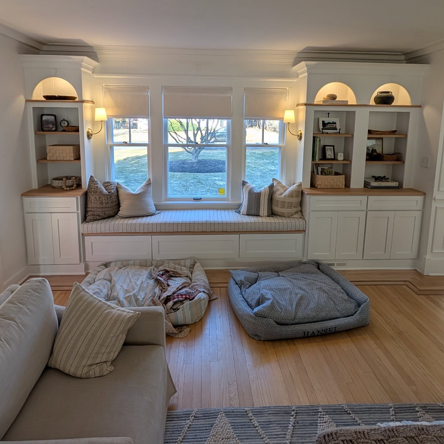 Incredible custom built-in cabinets with a center bench in a beautiful home in Niskyuna. Fit with interior cap lighting, sconces and natural oak counters and shelves. We teamed up with Smitkin Builders to complete this unit along with a full master suite remodel to come!
