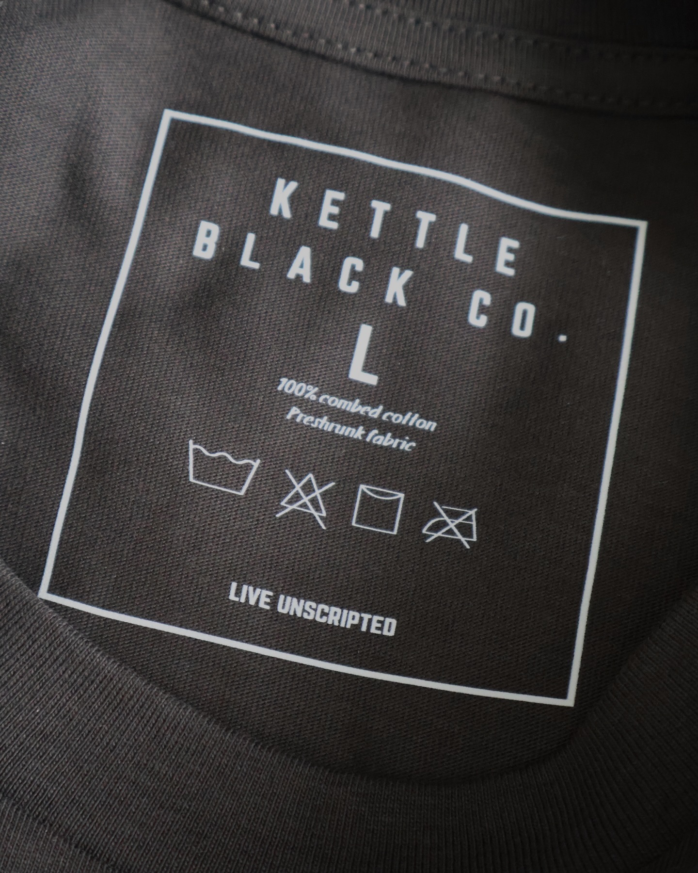Details matter. Our custom neck tags keep it comfy and clean — no itchy labels, just a smooth fit. Plus, a little remind to always Live Unscripted. Oh, and those symbols? Keep it cool when washing, skip the bleach, let it air dry, and definitely no ironing — some things are better left effortless 🤝🏼 🫡
#tshirts #customshirts #kettleblack #clothingbrand #tshirtdesigns #smallbusinessowner #shopsmall #detailsmatter #details