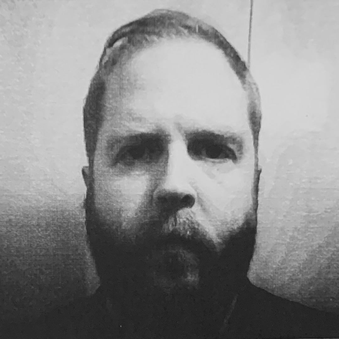 Obligatory author photo. Hate doing these but it's a must. Shot on a child's Mafiti camera that prints on receipt paper just using heat. Creates a cool effect and helps hide some of my least attractive features.