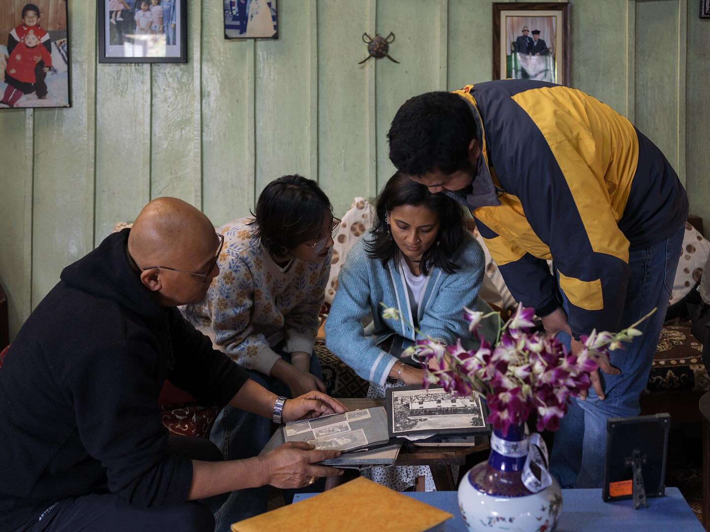 In the Darjeeling Hills and Sikkim, where oral history is key to preserving our heritage, family albums play a crucial role in documenting our past. At The Confluence Collective, we digitize these cherished albums, capturing stories, struggles, and triumphs that shape our identity. Each photo is a window into our history, offering a unique perspective on personal and political transformations.
As we visit each family, we are welcomed into their homes, often with a sense of reverence for the photos they hold. Each album we encounter opens up a world of stories, sometimes forgotten, sometimes shared with a sparkle in the eye. As we carefully flip through the pages, each family shares not only the stories behind the images but also the emotions and lessons attached to them. These photos spark memories, unlocking narratives about political upheavals, cultural shifts, and moments of personal triumph. The stories of these families stories we might never have heard if not for these images are brought to life before us, offering a rich tapestry of history that transcends the limitations of oral accounts alone.
By preserving these memories, we ensure the legacy of our ancestors endures for future generations, validating our existence and cultural richness.