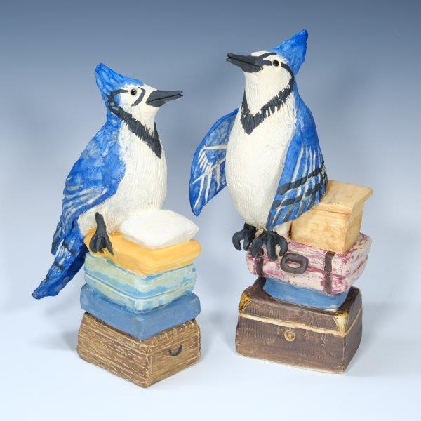Blue Jays, 2024
Bird Baggage Series
ceramic, handmade figurines
We all bring baggage to relationships. Birds often pair up and have wildly differnt relationship types.
Blue Jays, well, they would bring trunks and boxes.
What type of bird would you and your partner be?
a pair of blue jays perched on stacks of suitcases, trunks,and boxes.
a closeup of the deatil on the blue jay sculpture
find this pair forsale at @heightsarts in their gallery shop
