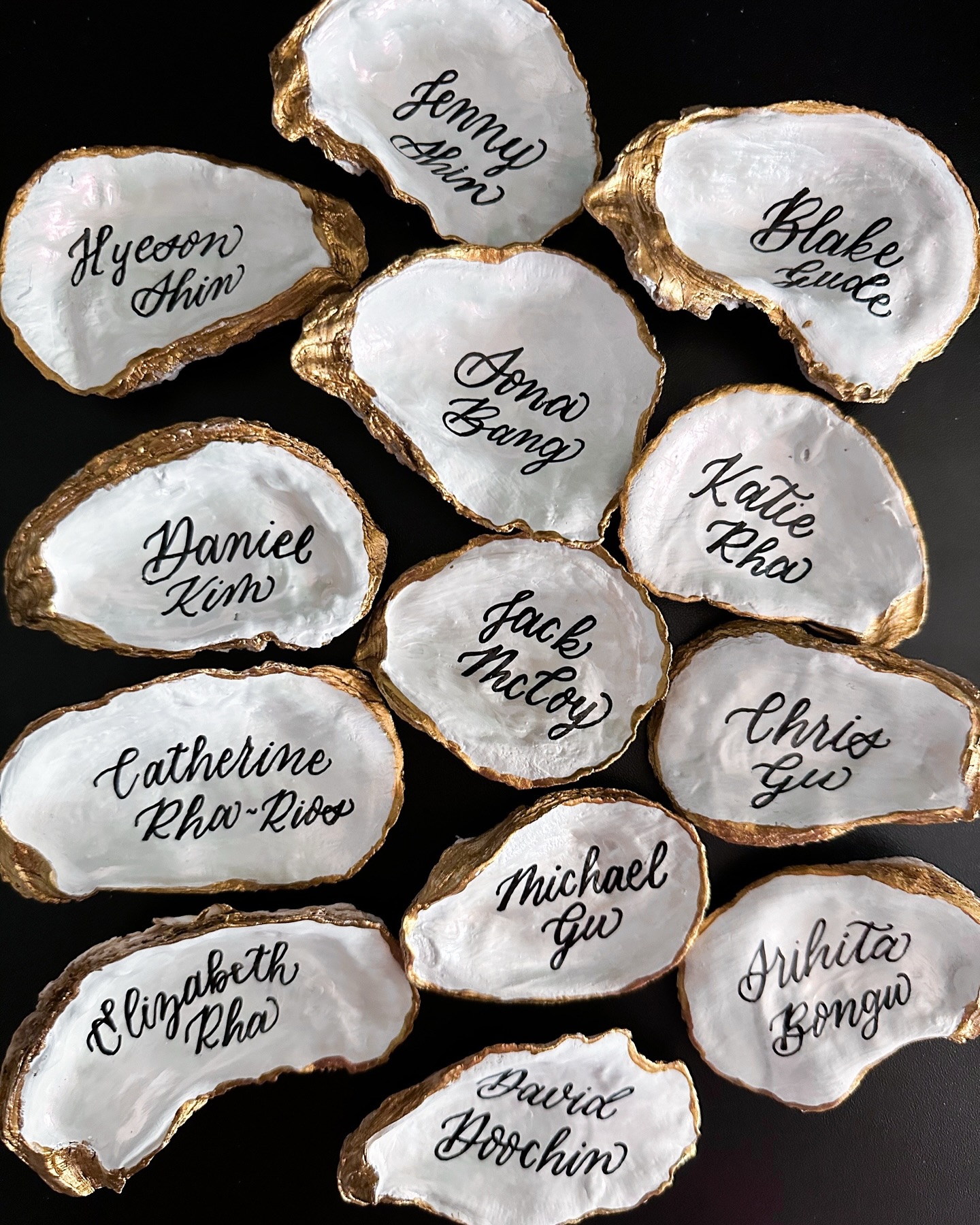 Shell we make your escort cards fun? 🦪
Oyster shells have been a popular choice lately and lucky for me, are sticking around for another wedding season (can’t wait to show you what’s in store for a destination wedding this spring!) These beauties traveled all the way to Portugal and made the perfect beachy escort display (their table numbers are on the back!)
Want to do something out of the box for your seating chart or escort display? Let’s chat! 👋🏻
#allicatcalligraphy #weddingcalligraphy #phillycalligrapher #southjerseycalligrapher #phillywedding #oystershells #escortcards #seatingdisplay #beachwedding #destinationwedding