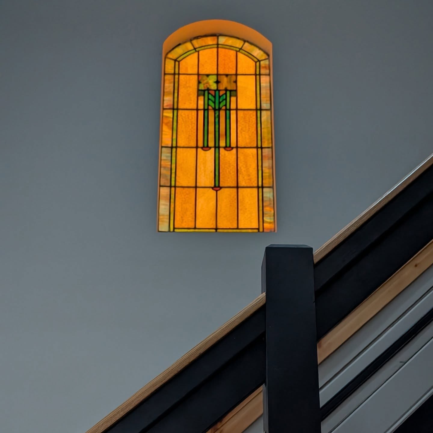 The light was just right on the stained glass above our modern staircase design.