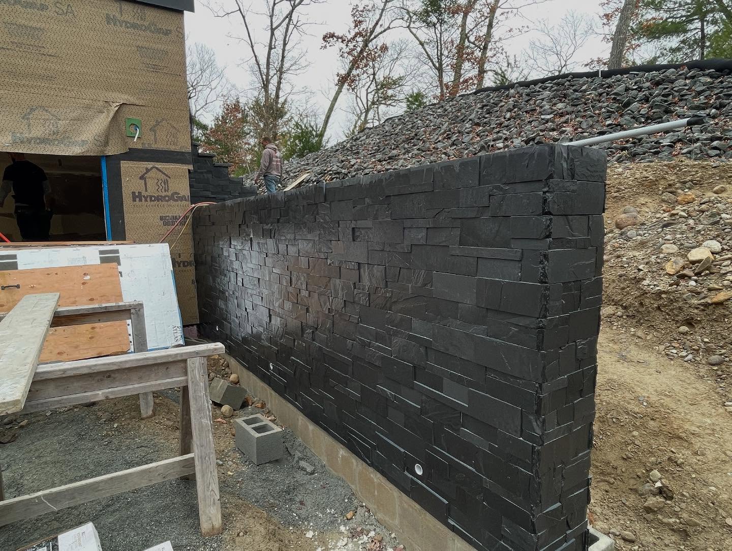 Stone Terrace & Retaining Wall Progress
The retaining wall is fully wrapped in black veneer stone, giving it a rich, textured look. Next up, we’ll be capping it with granite, which will add a clean, refined edge. Over by the bonus room, the stair set is starting to take shape. It’ll be wrapped in the same black veneer stone and finished with solid granite treads, leading up to a generous granite landing.
One of the details we’re excited about is the terrace walkway. We’re lining it with large, decorative retaining boulders, which will help blend the space into the natural surroundings. The scale and variety of the stonework should give the whole area a balanced, organic feel. Looking forward to sharing more as this comes together.
Masonry work by: @idealpathway
#Stonework #LuxuryHomes #EchelonBuilders #OutdoorLiving #CustomCraftsmanship
#architecture #home #builder #interior #luxury #construction #massachusetts #bostonma #cleanjobsite #handmade #gobuild #masonry #handmade #terrace #customhome #rhodeisland #waterfront #landscape #hardscape #naturalart
