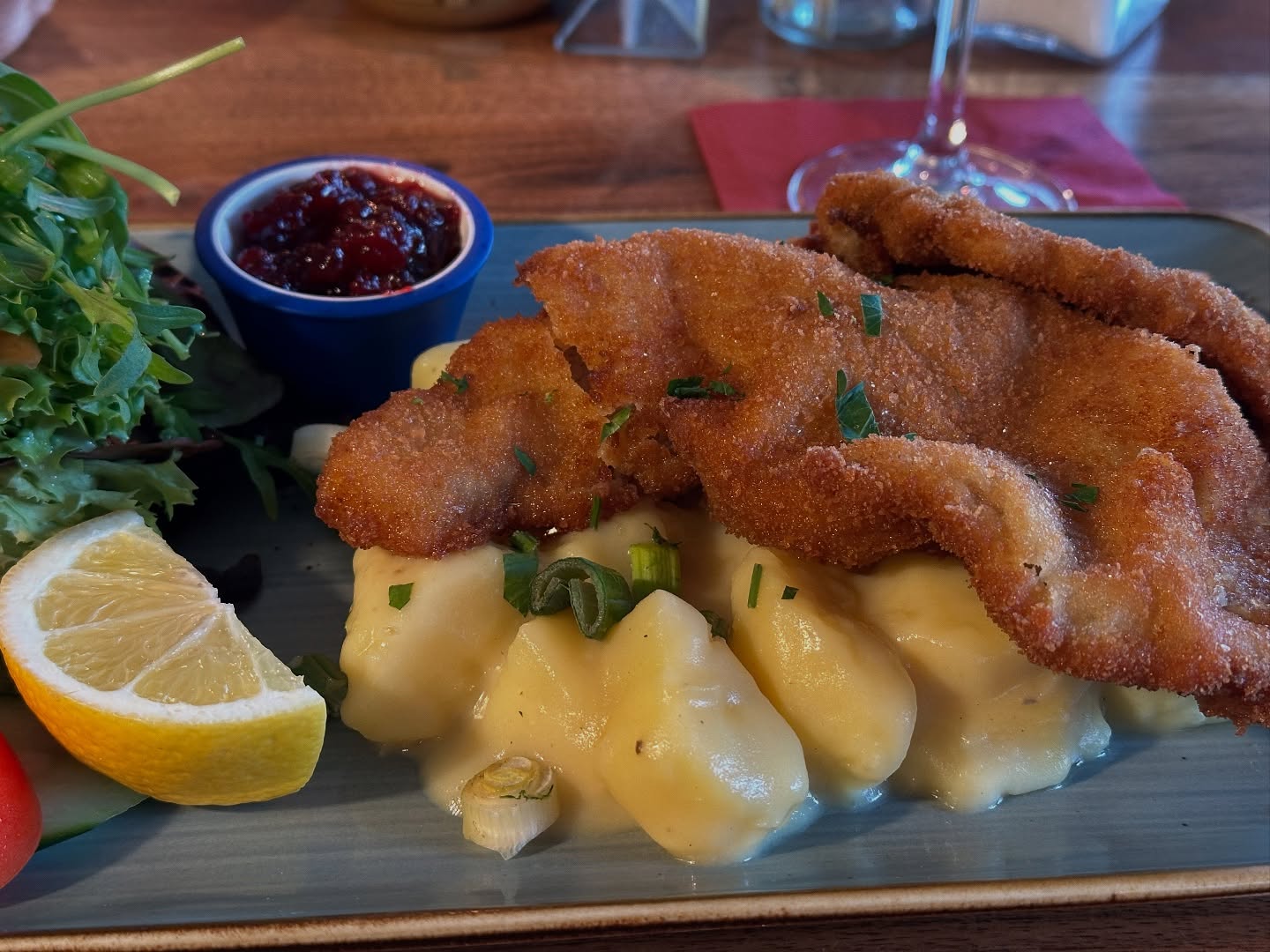 My Central European genes start vibrating when I am eating warm potato salad and schnitzel with cranberry (even though they call it here Kartoffeln instead of Erdäpfel) - and especially from those typical wooden tables and chairs.
