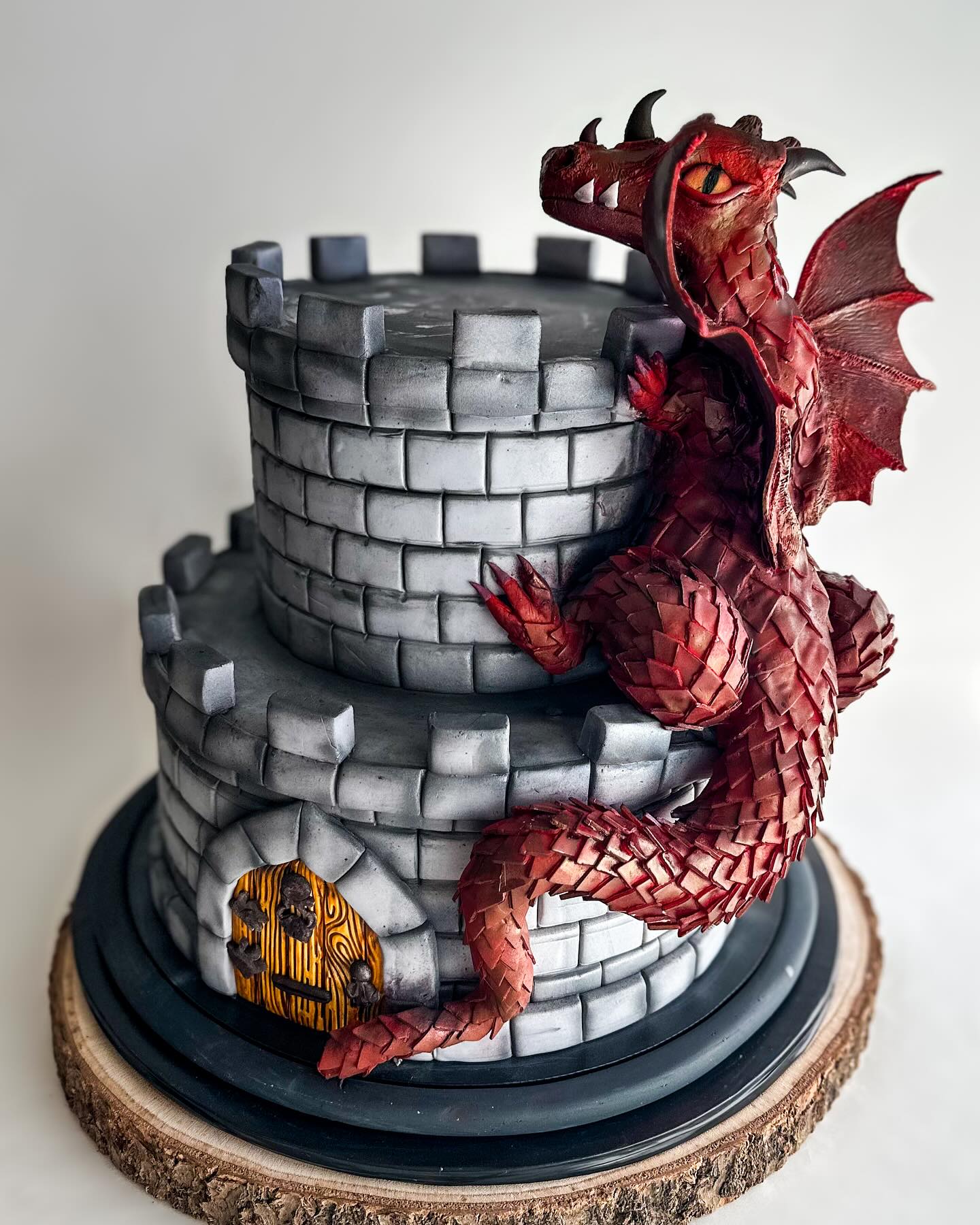 Who’s coming to save you from this dragon, Prince Charming or Shrek?
…
This Dragon is completely hand sculpted fondant. Each scale was placed meticulously on its body. This work of art was a labor of love.
#customcake #castlecake #dragoncake #dragons #castle #birthdaycake #fondantcake